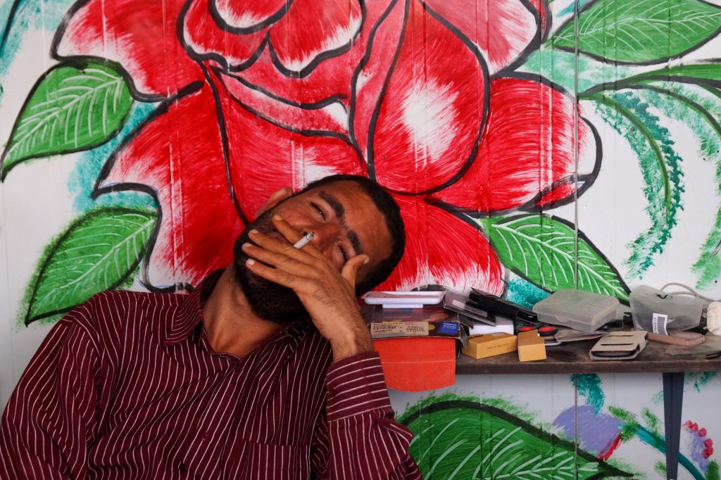 Some Syrian refugees are creative, like this man who has decorated his cell phone shop, which is made from a caravan. Others, however, are begging on the streets of Za’atari. (Photo by Kirsten Koza)