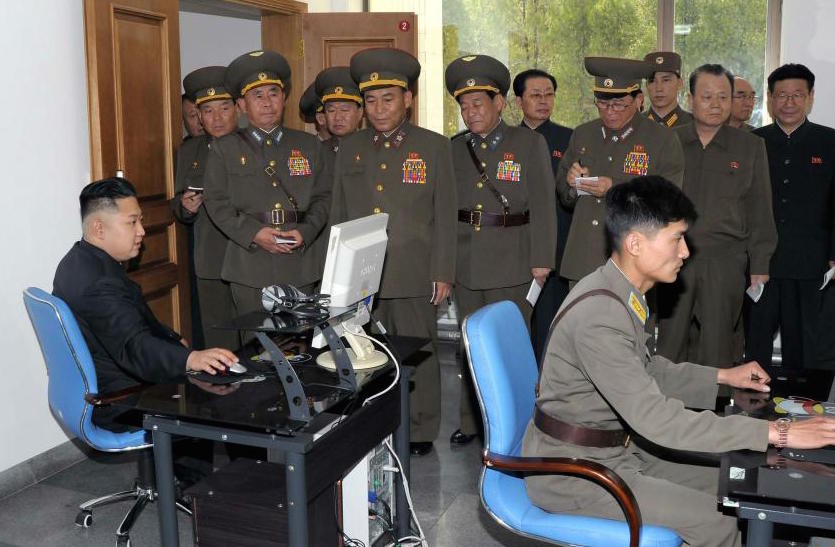 North Korean leader Kim Jong-un uses a computer at a military base. Hackers had access to Sony's internal network since at least July and may have had inside help in the cyberattack, a government official told our reporter. (KCNA photo)
